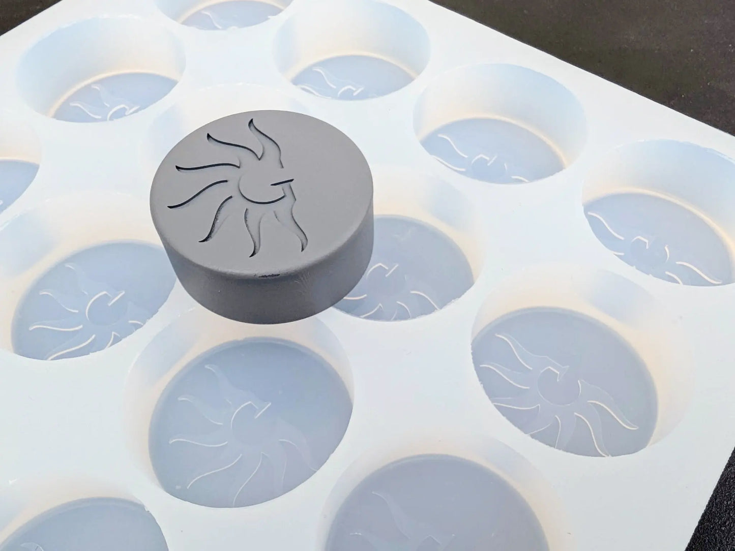 Artisan workshop using personalized soap molds.
Finished soaps with custom text made from silicone mold.